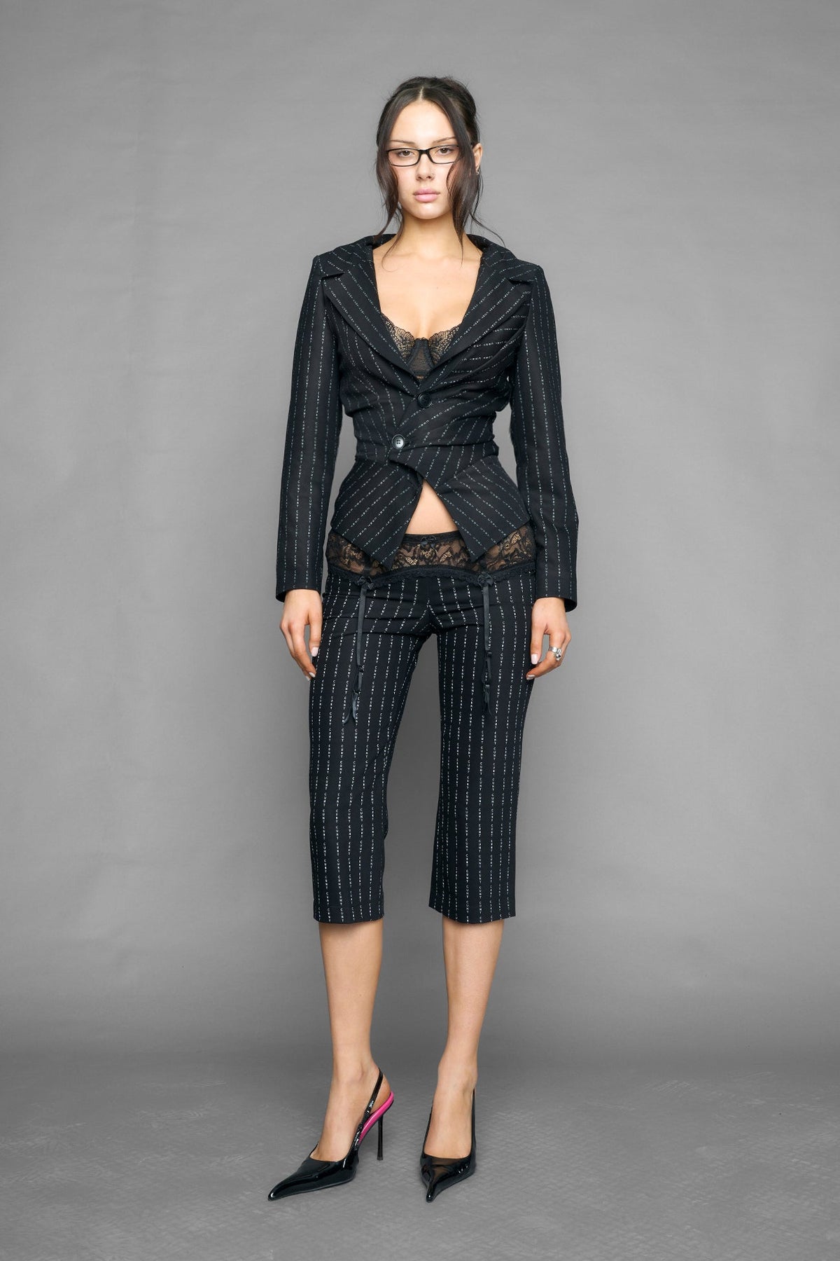 model wearing capri pinstripe pants black with garter design