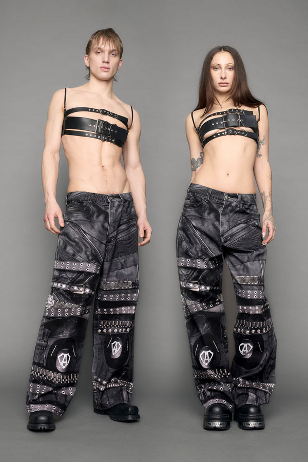 model wearing black printed motocross denim pants - black