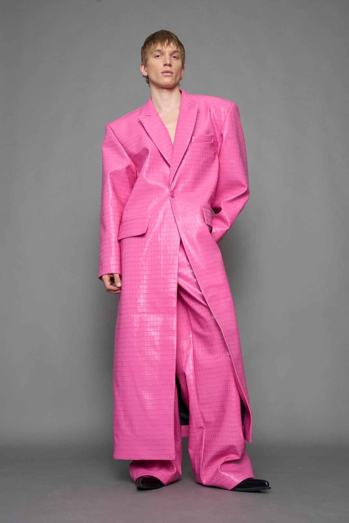 model wearing pink vegan leather croc optic blazer coat
