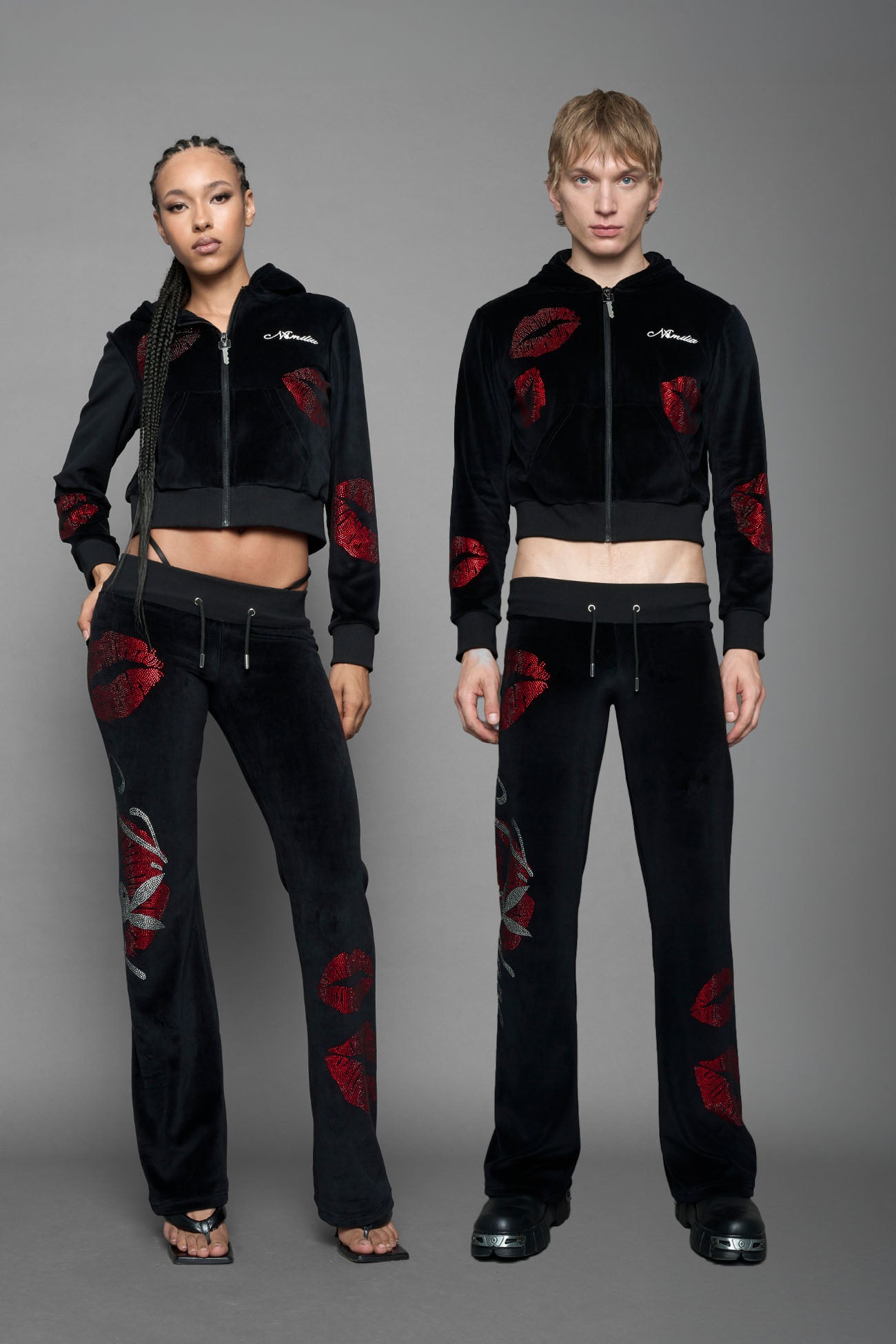 model wearing black red crystal embroidered jogger pants 