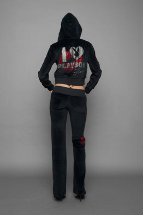 model wearing black red crystal embroidered jogger pants 