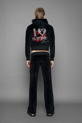 model wearing black red crystal embroidered jogger pants 