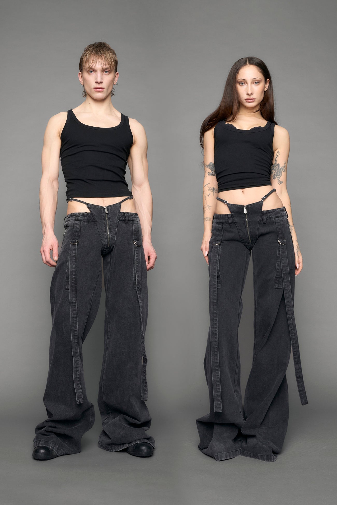 model wearing black grey denim with belt and thong