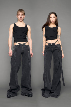 model wearing black grey denim with belt and thong