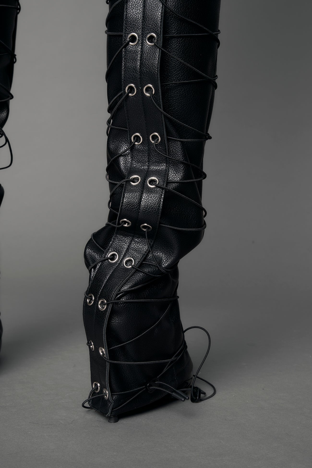model wearing black vegan leather low waist skinny pants