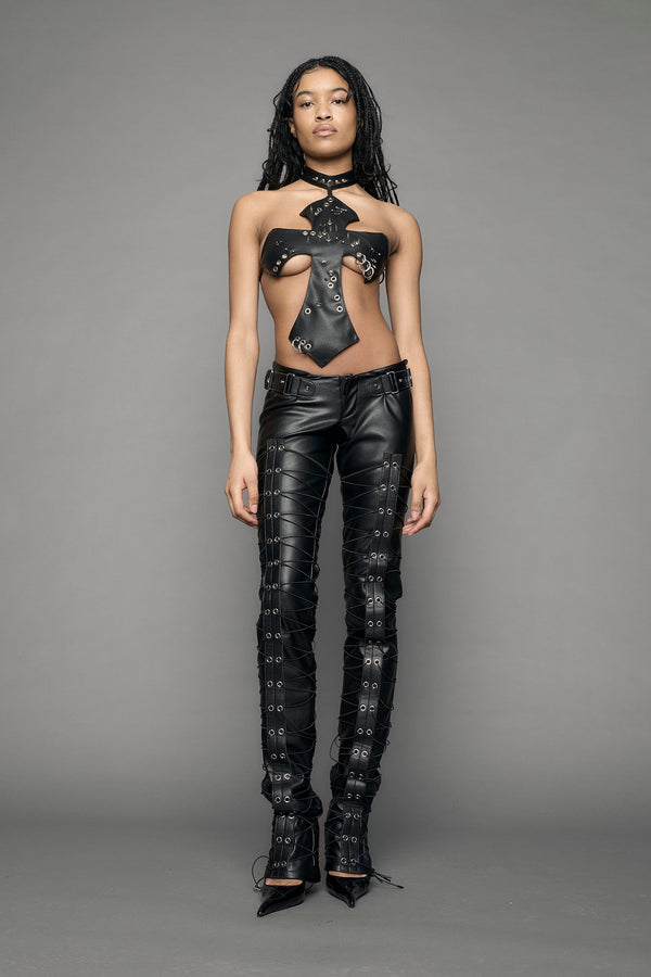model wearing black vegan leather low waist skinny pants - black