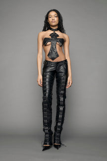 model wearing black vegan leather low waist skinny pants