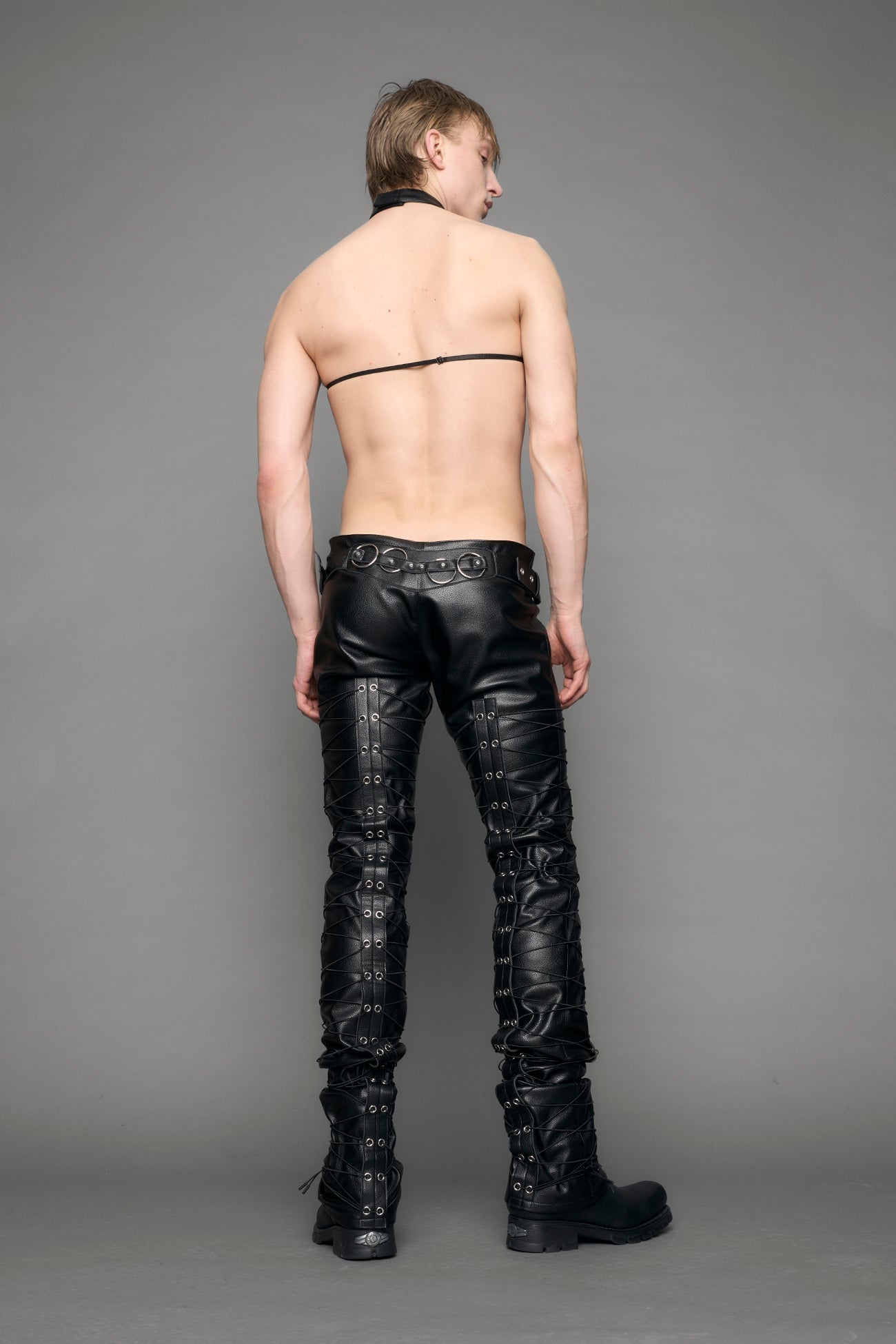 model wearing black vegan leather low waist skinny pants
