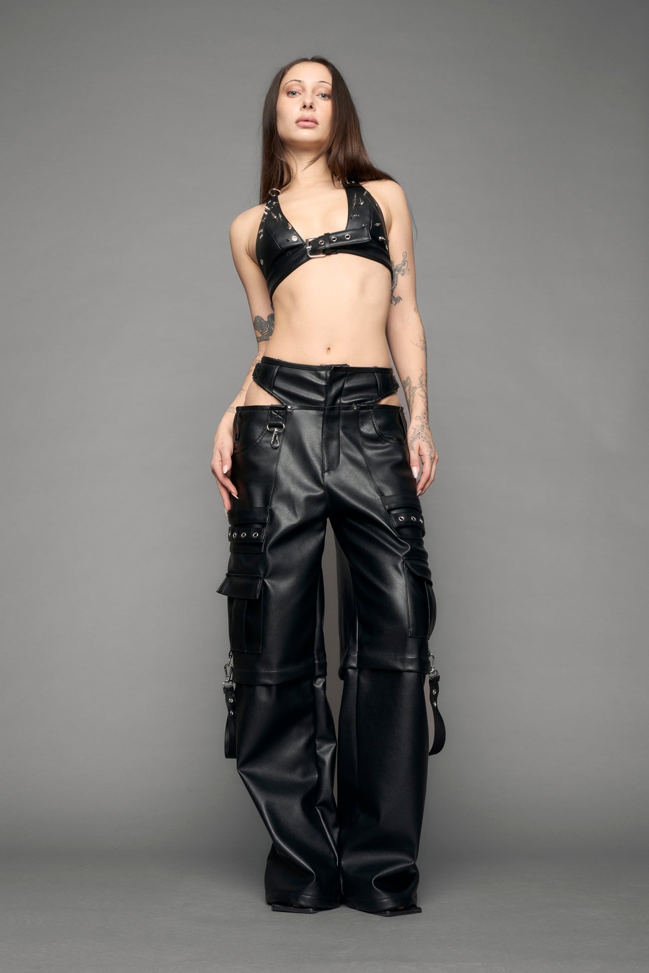 model wearing black vegan leather cargo panty pants