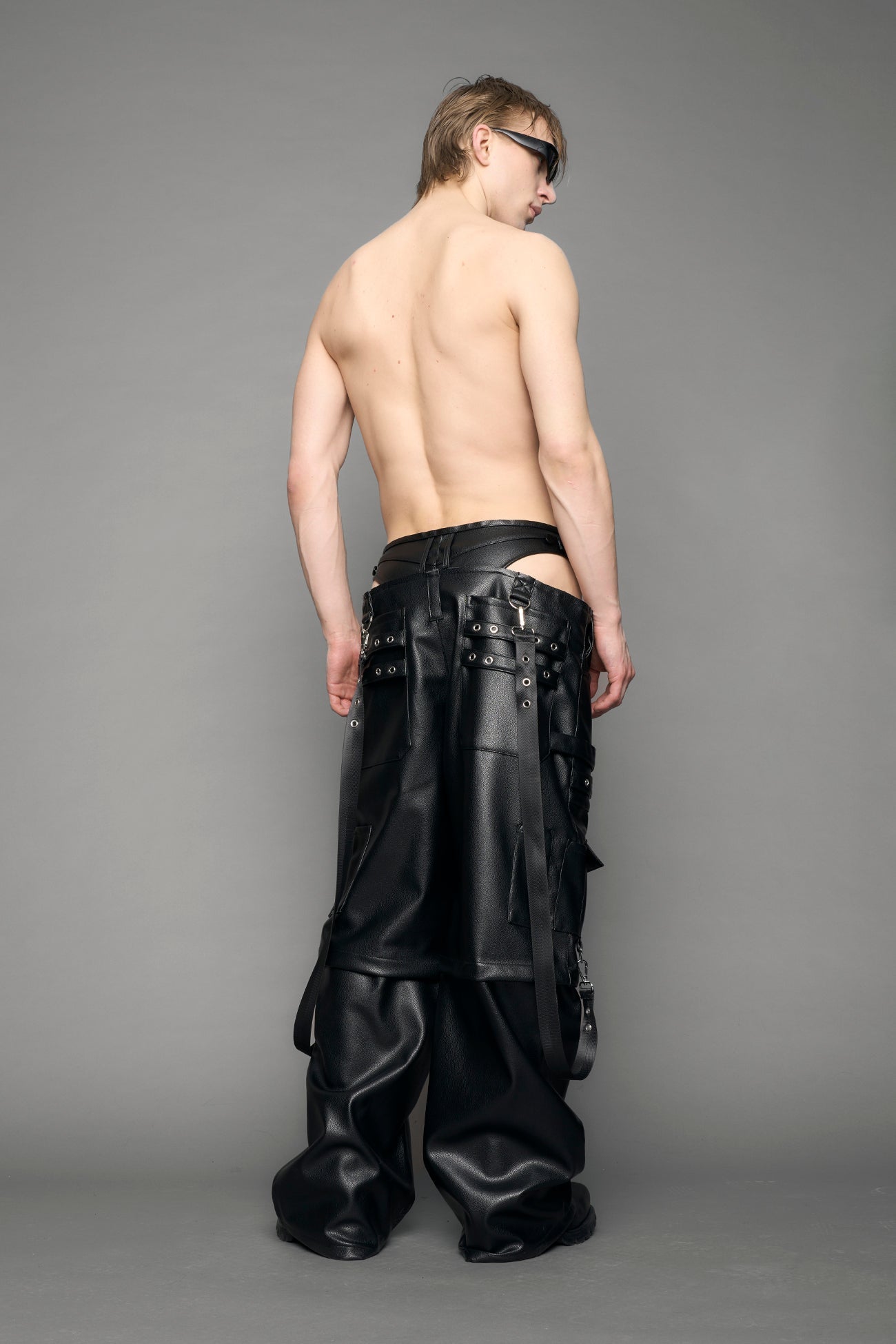 model wearing black vegan leather cargo panty pants