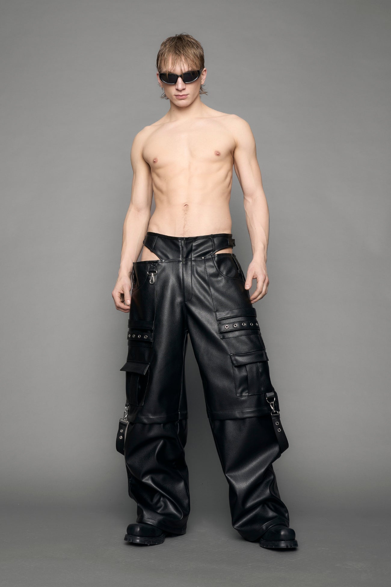 model wearing black vegan leather cargo panty pants