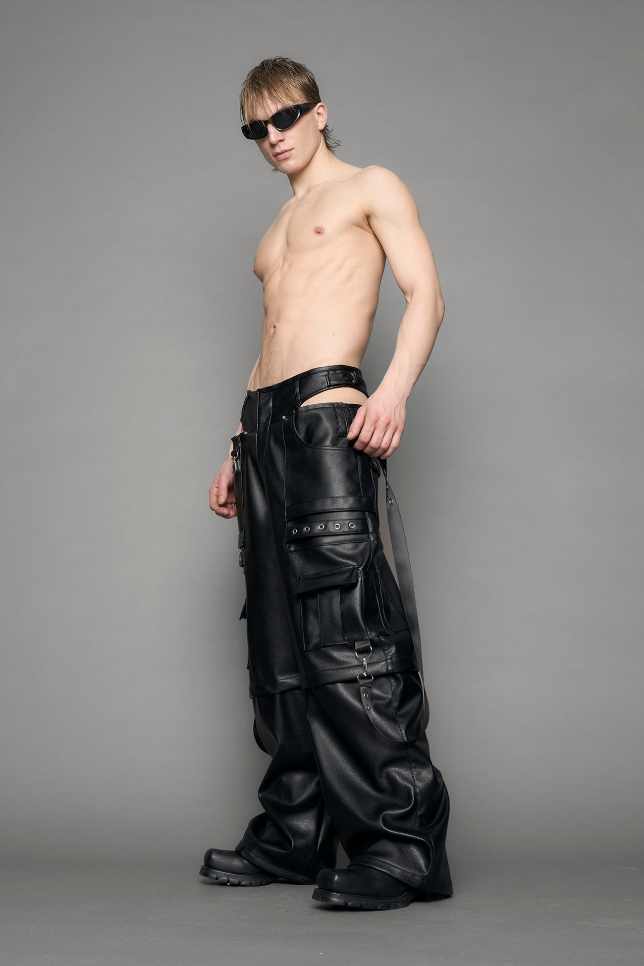 model wearing black vegan leather cargo panty pants