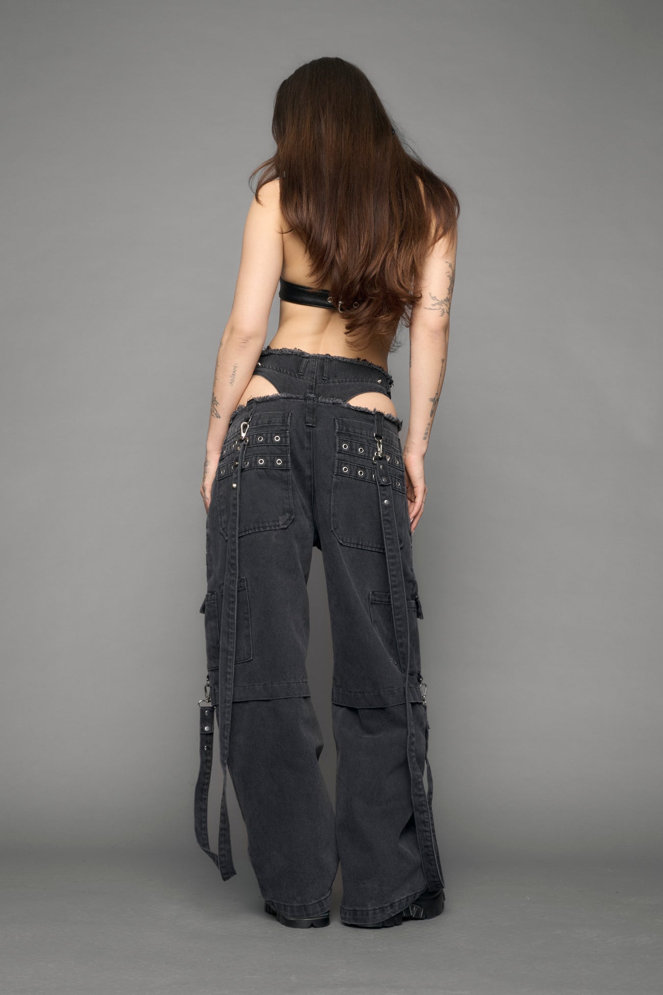 model wearing black denim cargo panty trousers