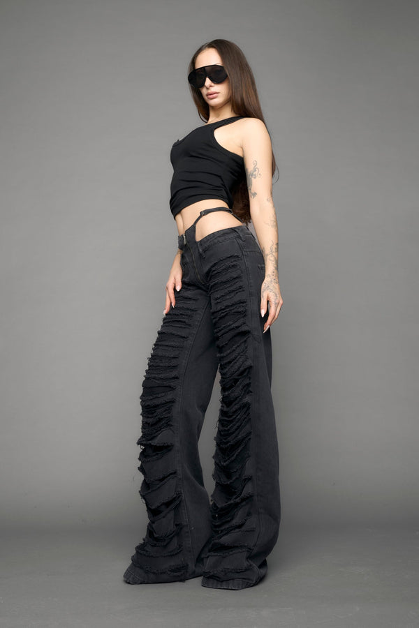 model wearing black denim thong pants used look