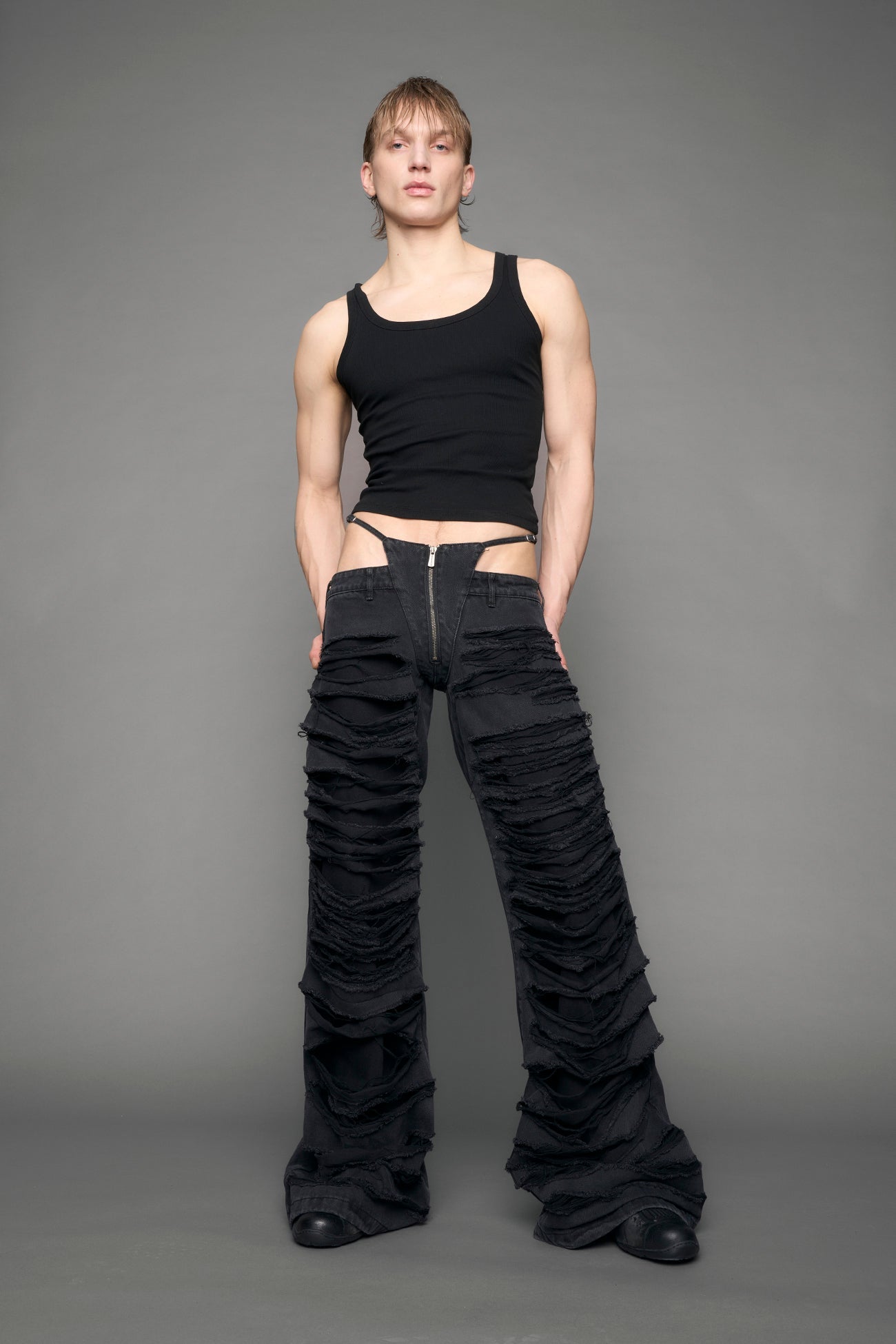 model wearing black denim thong pants used look