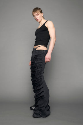 model wearing black denim thong pants used look