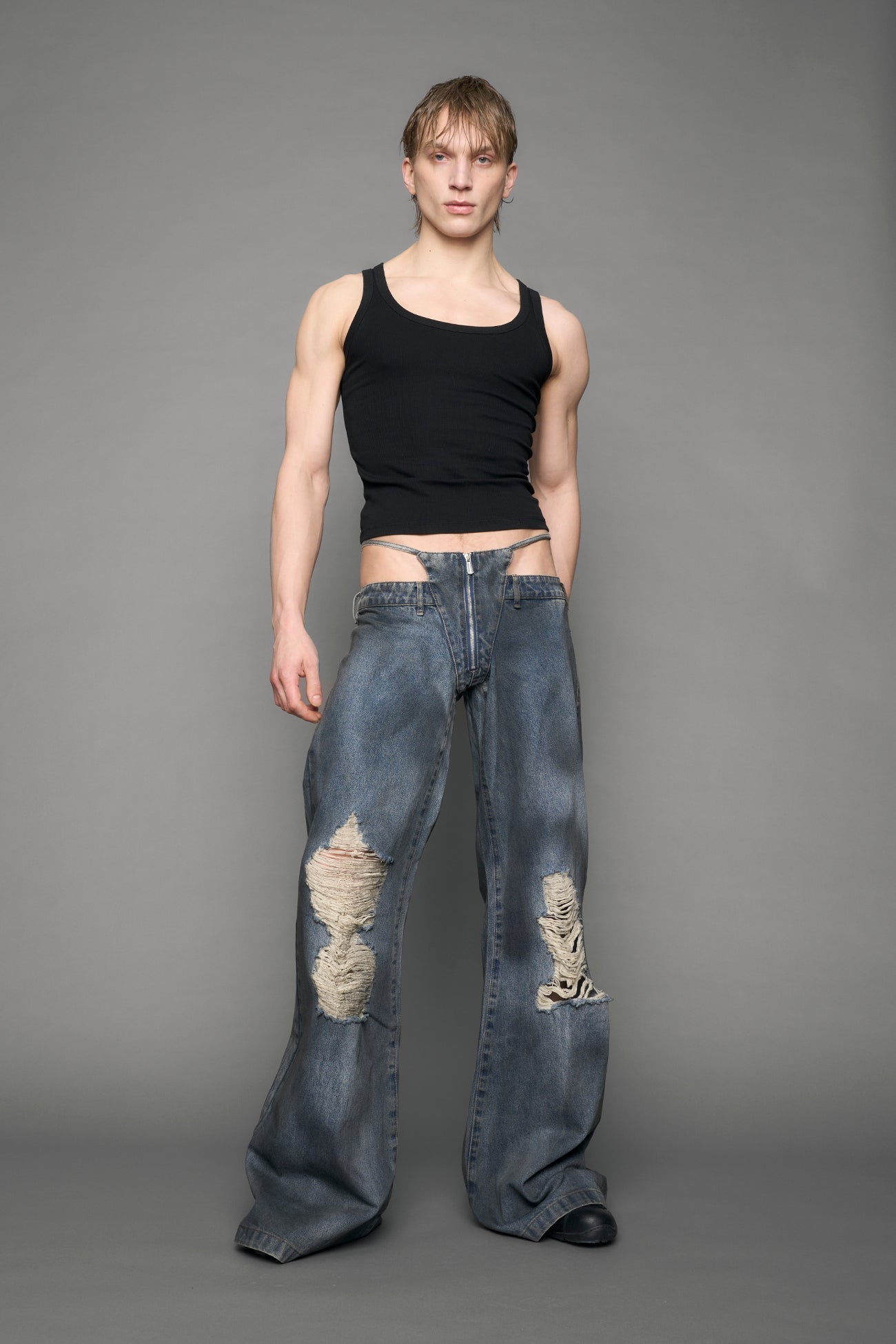 model wearing blue denim thong pants used look
