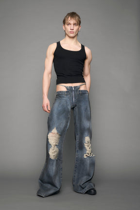 model wearing blue denim thong pants used look