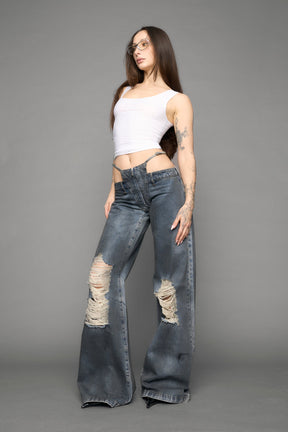 model wearing blue denim thong pants used look