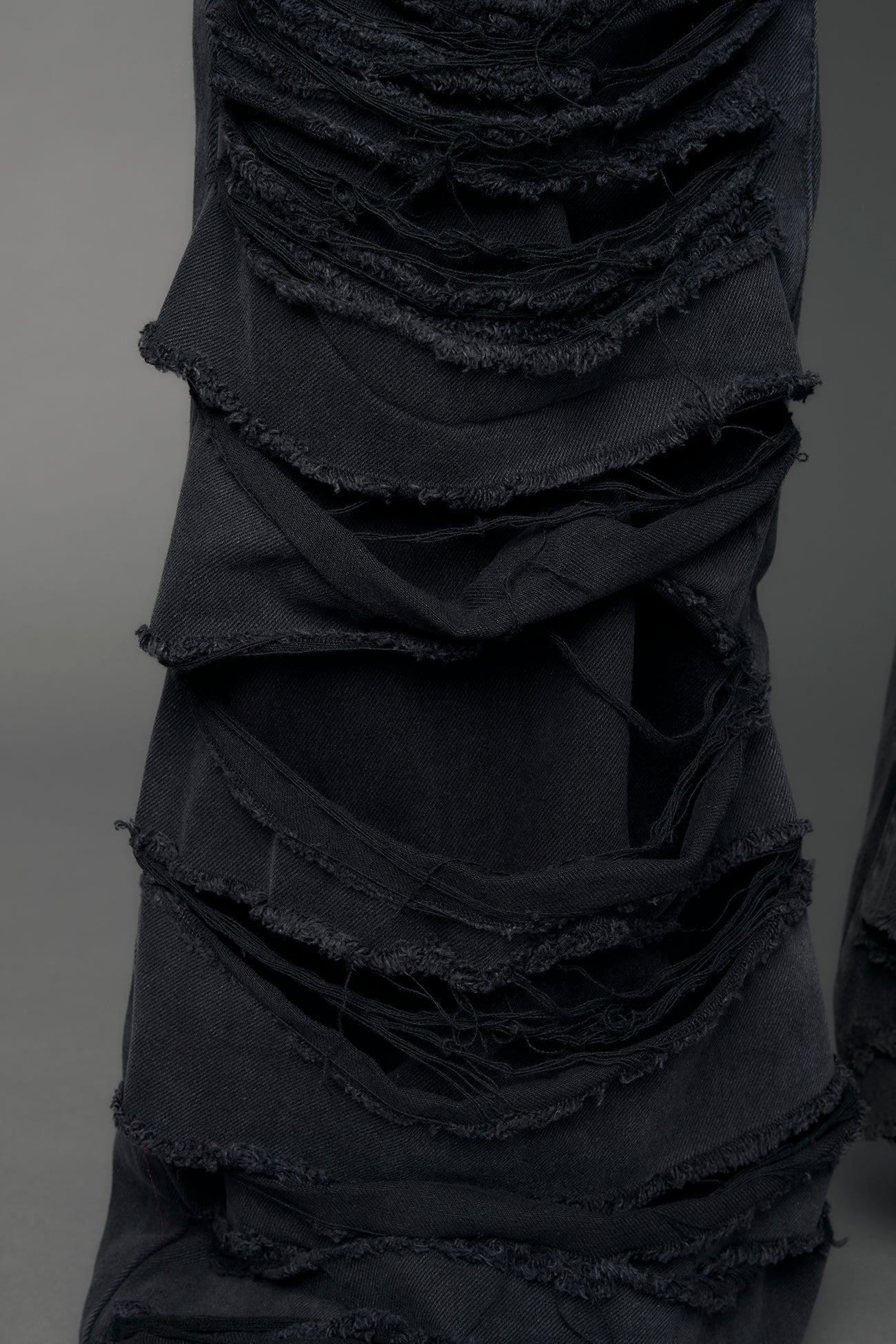 model wearing black denim thong pants used look