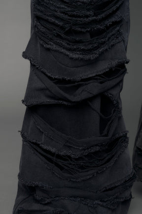 model wearing black denim thong pants used look