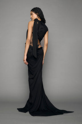 model wearing long black draped dress