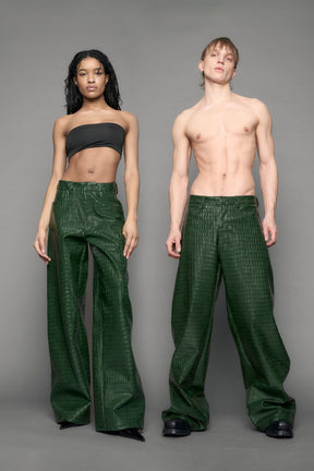 model wearing green vegan leather croc pants