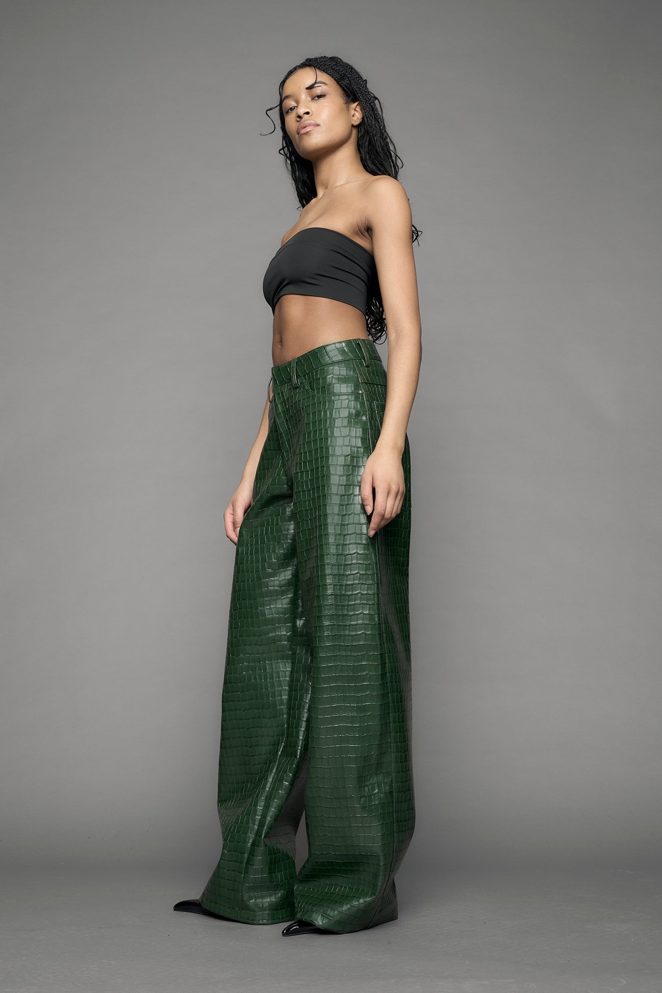 model wearing green vegan leather croc pants