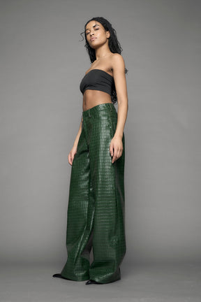model wearing green vegan leather croc pants