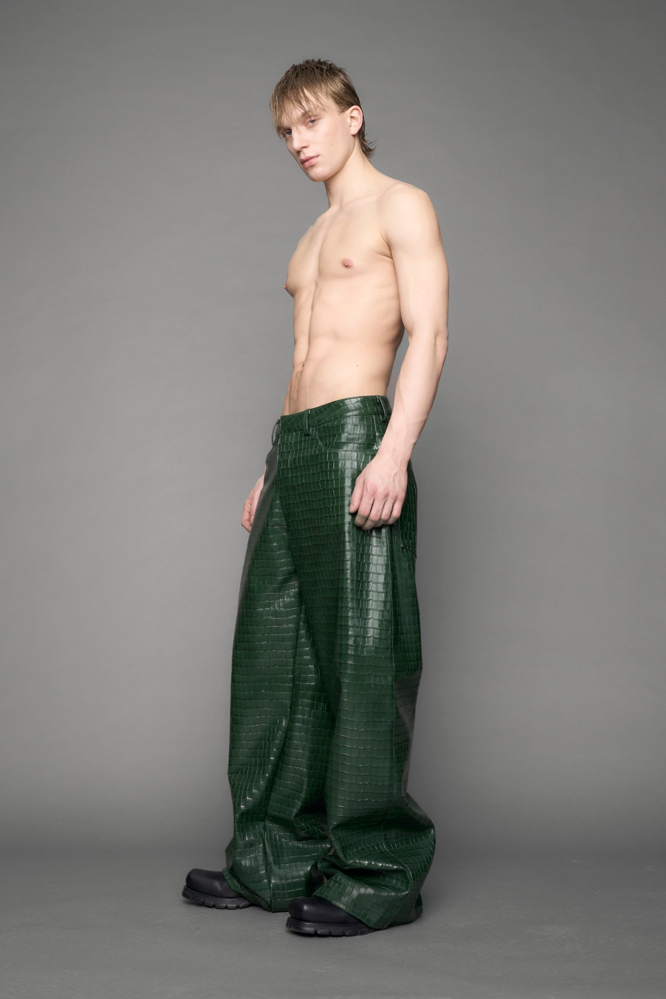 model wearing green vegan leather croc pants