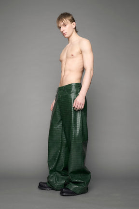 model wearing green vegan leather croc pants