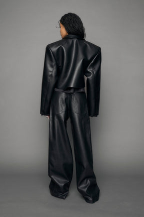 model wearing black vegan leather blazer cropped