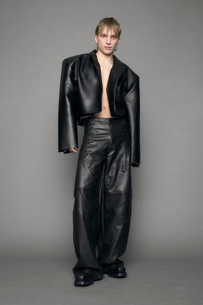 model wearing black vegan leather blazer cropped