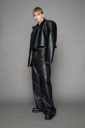 model wearing black vegan leather blazer cropped