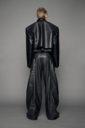 model wearing black vegan leather blazer cropped