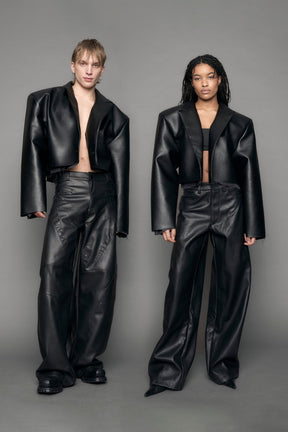 model wearing black vegan leather blazer cropped