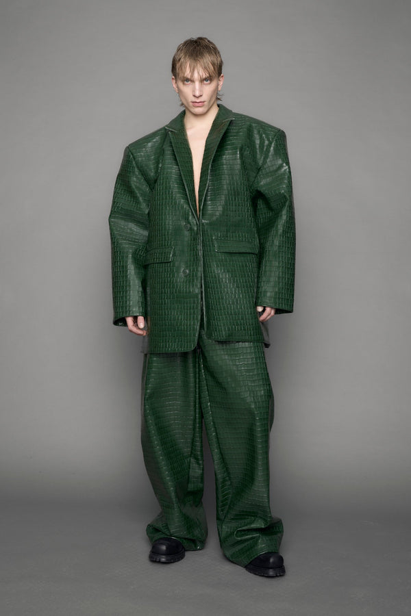 model wearing green croc vegan leather blazer