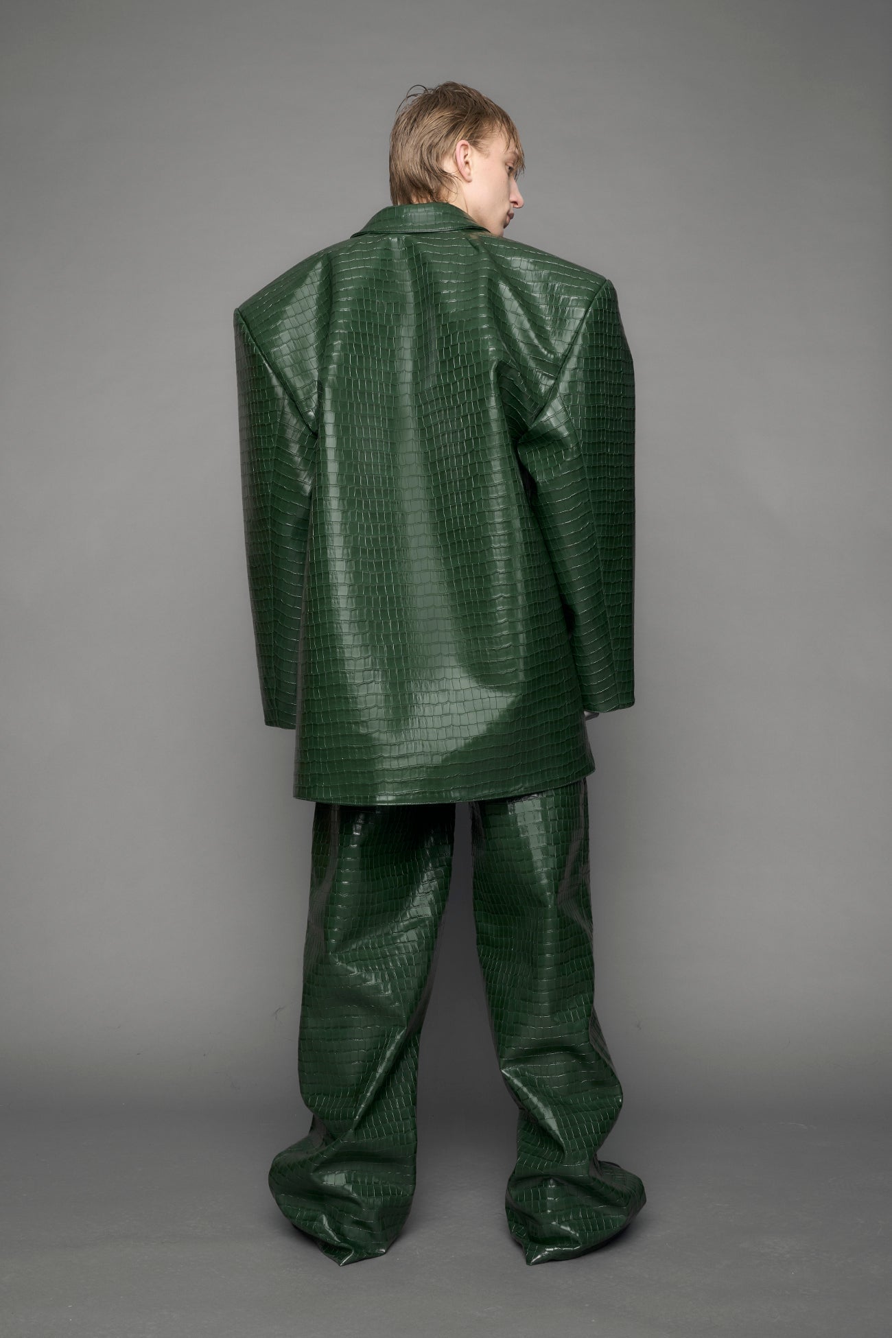 model wearing green croc vegan leather blazer