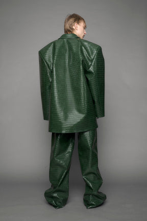 model wearing green croc vegan leather blazer