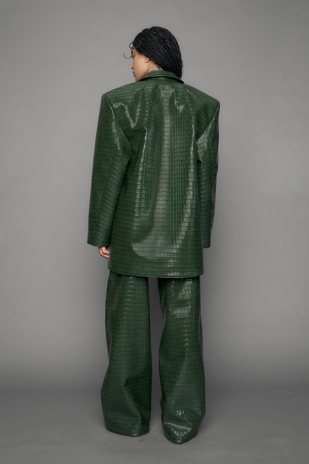 model wearing green croc vegan leather blazer