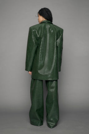 model wearing green croc vegan leather blazer