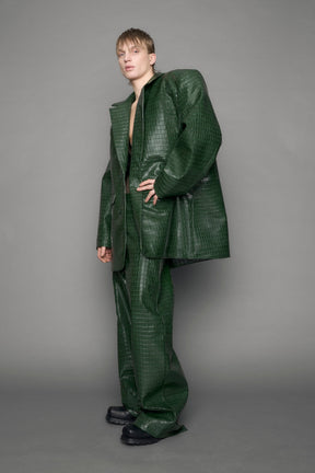 model wearing green croc vegan leather blazer