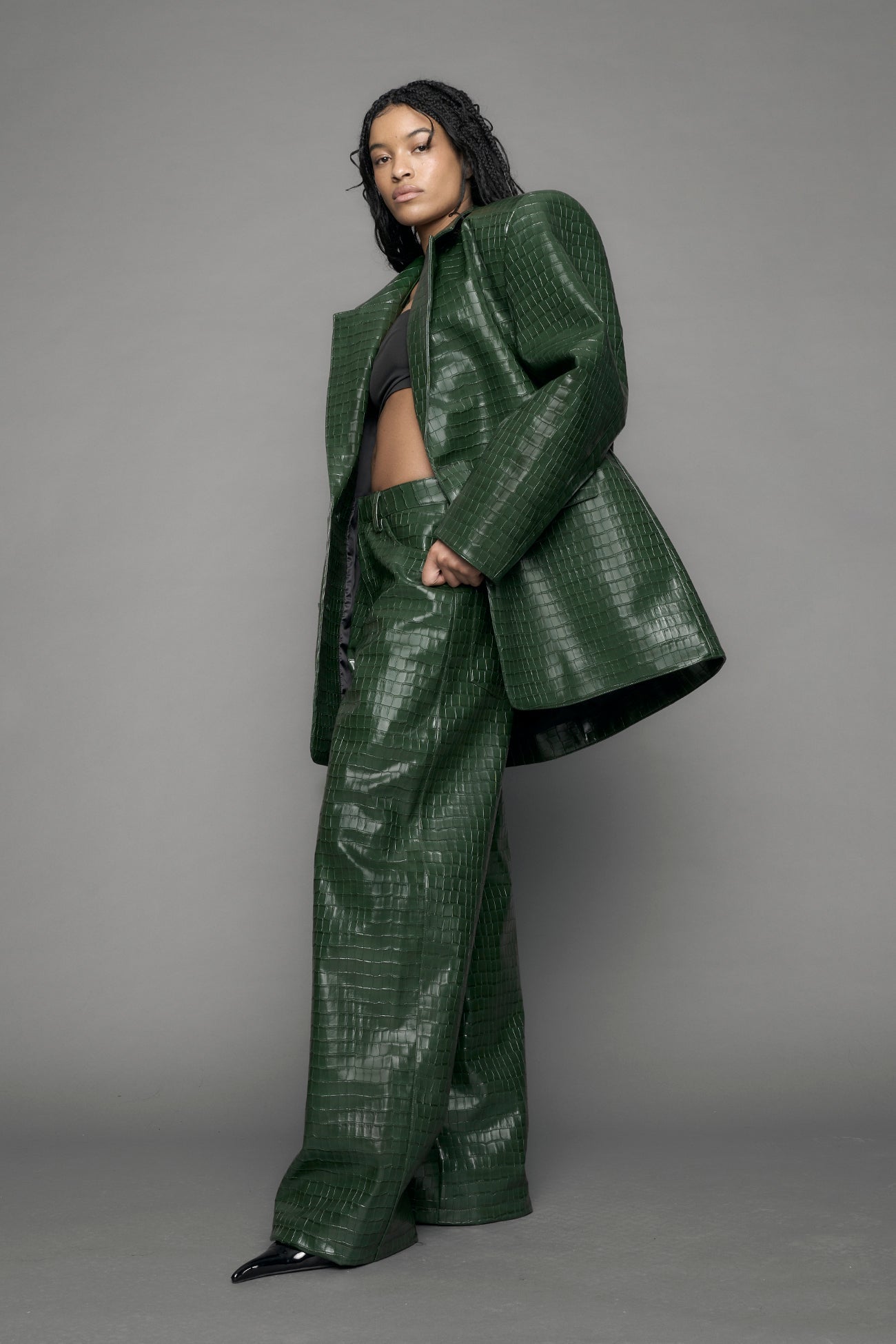 model wearing green croc vegan leather blazer