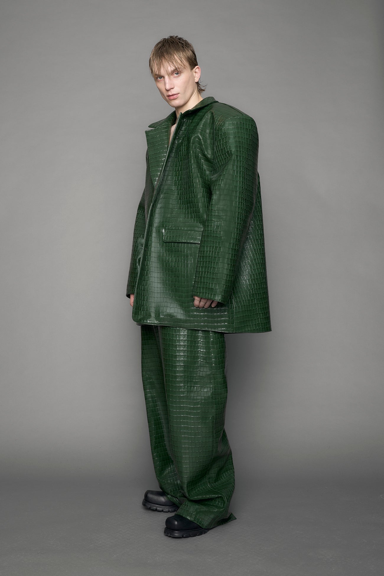 model wearing green croc vegan leather blazer