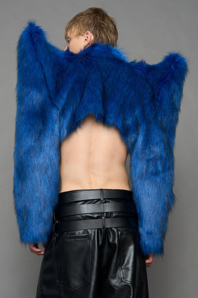 model wearing blue faux fur crop jacket with sharp shoulder design and black pants