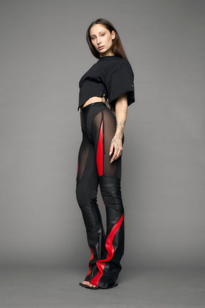 model wearing black red moto mesh pants