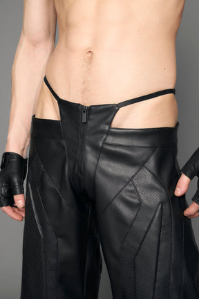 model wearing black vegan leather perforated thong pants