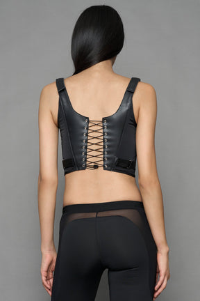 black faux leather lace up corset with sharp design details and buckle and ring details