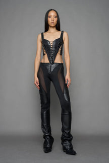 black faux leather lace up corset with sharp design details and buckle and ring details