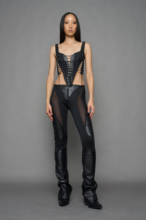 black faux leather lace up corset with sharp design details and buckle and ring details